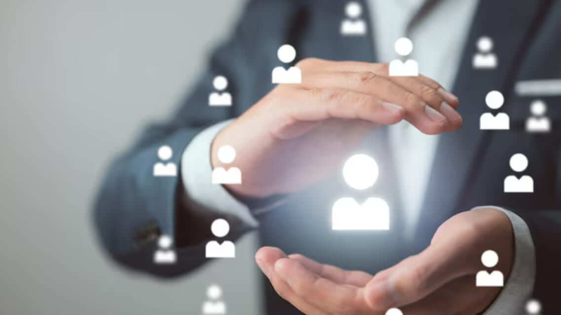 Concept image of a hand surrounding digital profile icons